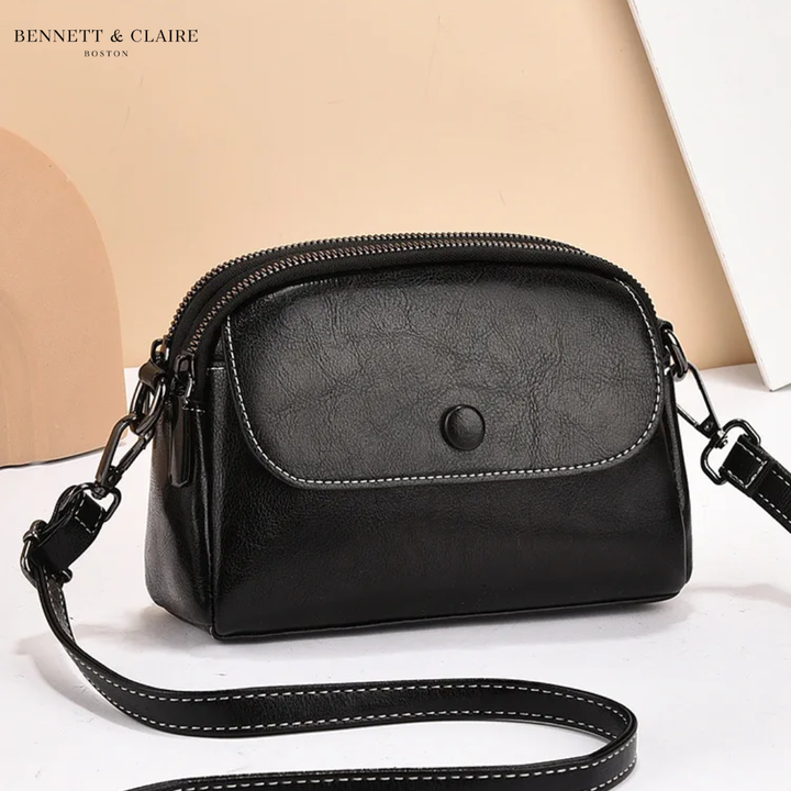 Cross-body bag with multiple pockets and adjustable strap