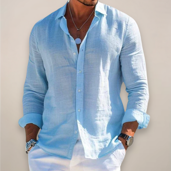 Relaxed-fit men's linen shirt with front button placket and long sleeves.