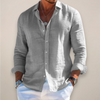 Relaxed-fit men's linen shirt with front button placket and long sleeves.