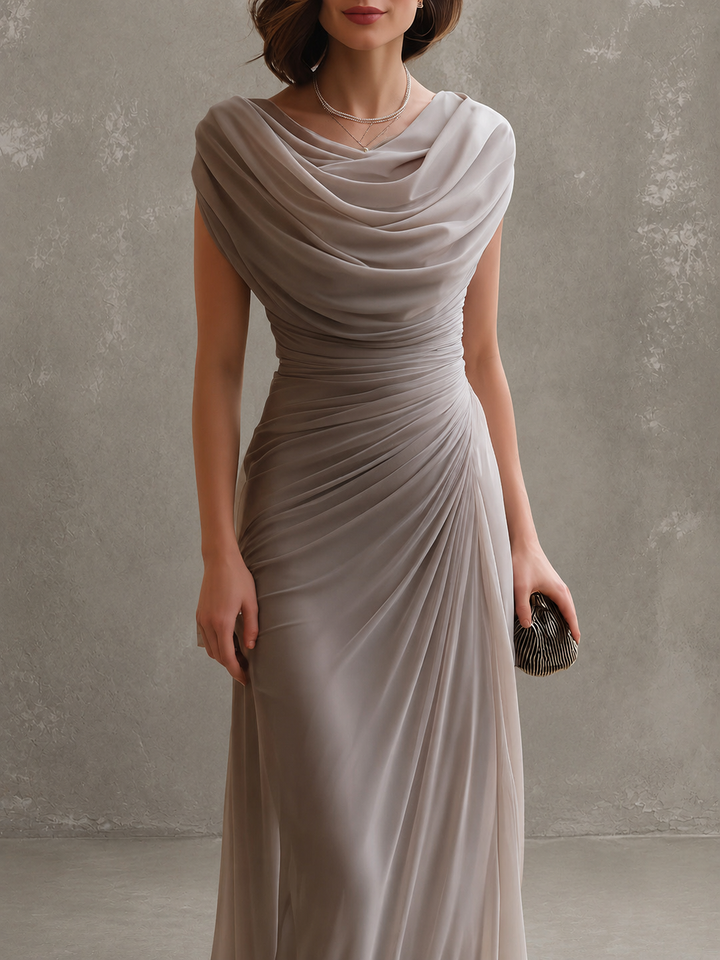Draped sleeveless maxi dress with flowing floor-length skirt