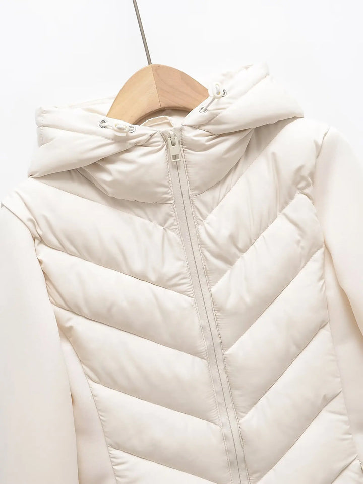 Lightweight Women's Quilted Winter Jacket with Hood and Hidden Pockets.