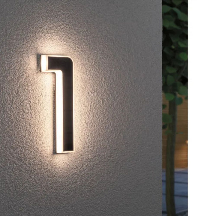 Solar-lit house number with LED and dusk sensor
